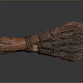 Handmade Brown Broom With Woven Handle And Natural Bristles On Gray Smooth Surface With Reflection
