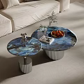 Round Blue Marble Coffee Tables With Silver Ribbed Bases And Decorative Figurine Plant Fruit Plate