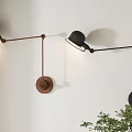 Modern Brown Black Wall Lamps with Adjustable Arm Design Mounted on White Wall