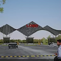 Modern Geometric Arch Entrance Gate Structure With Logo Vehicles And Pedestrians