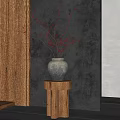 Grayish Pottery Vase With Red Berry Branches On Wooden Pedestal Against Dark Gray Wall