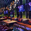 Elegant Bar Interior Featuring Leather Sofas Union Jack Cushions Large Screens And Green Walls
