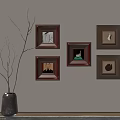 Five Framed Pictures on Wall with Vase and Branches in Modern Interior Decor