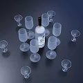Transparent Wine Glasses Arranged Around White Label Bottle On Dark Background