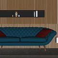 Blue Tufted Two Seater Sofa with Red Cushions Wooden Wall Black Shelf and Round Mirror