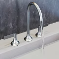 Contemporary Stylish Faucet Designs in Brushed Gold and Chrome with Smooth Water Flow on Countertop Surfaces