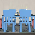 Playful Kids Table With Blue Pink Chairs And Toys On Rug And Light Colored Walls