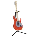 Red Electric Guitar With Wooden Body On Black Stand For Musical