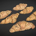 Freshly Baked Whole Grain Croissants With Sesame Seeds On Dark Surface