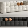 White and Black Sectional Sofa with Square Tufted Design and Two Brown Balls 3d model