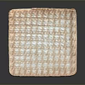 Square Sculpture Carving With Intricate Grid Pattern On Light Colored Surface