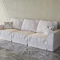 Light Gray Sectional Sofa With Geometric Patterned Pillows On Marble Floor And Light Colored Wall 3d model