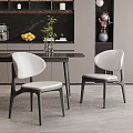 Modern Dining Room Interior With Black Dining Table White Chairs And Plant Decor