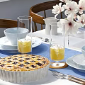 Elegant Dining Table Set With Wooden Chairs White Flowers Blue Runner And Homemade Pie