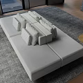 Light Gray Sectional Sofa With Decorative Pillows On Gray Area Rug In Modern Living Room