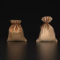 Elegant Decorative Ornament Set With Two Golden Satin Drawstring Pouches On Black Reflective Backdrop