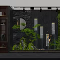 Modern Indoor Garden Decor With Black Stone Wall Round Mirror Green Plants And Crane Sculpture