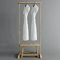 Wooden Storage Rack With Hanging Rod Holding White Clothes And Small Bottom Platform