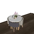 Round White Marble Dining Table with Gray Beige Chairs Wooden Legs Pink Flowers Decor Placemat
