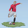 A Man In Red Manchester United Jersey Kicking Football On Green Grass Field