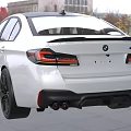 White BMW M5 Sport Sedan Front Design Featuring Sporty Grille Headlights And Vents In Showroom
