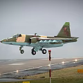 Camouflaged Fighter Jet Taking Off From Runway With Red Tail Insignia