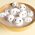 Delicious Smiley Face Dessert Dumplings in Yellow Bowl with Sweet Syrup