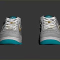 Gray Sports Shoes With Gold Side Accents White Laces And Teal Soles