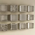 Various Designed Square Boxes Arranged On Light Colored Wall Surface