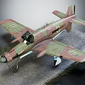 Camouflage Military Aircraft Model With Cross Insignia On Ground