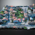 Detailed Miniature Town Model Featuring Houses Colored Roofs Green Spaces And Roads
