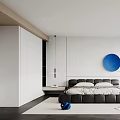 Modern Bedroom Interior Design With White Walls Blue Circular Artwork Black Bed And Accent Chair