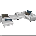 Modern Living Room Sectional Sofa With White Upholstery Brown Pillows And Soft Throw Blanket
