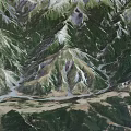 Breathtaking Aerial Natural Scenery Of Lush Mountain Ranges With Meandering River And Dense Green Forests