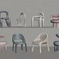 Various Modern Children's Chairs With Pastel Colors And Minimalist Designs Arranged On Shelves