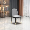 Modern Grey Leather Dining Chair With Black Legs And Gold Accents