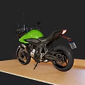 Green Sleek Modern Motorcycle With Black Accents On Wooden Display Floor