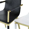 Dark Wooden Oval Dining Table Set With Black White Chairs Gold Legs And Decorative Items