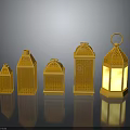 Golden Decorative Furniture Lanterns In Different Sizes With Carved Patterns And Illuminated Design