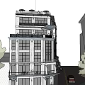 Commercial Street Featuring Multi Story Building Ground Floor Shops Balconies And Street Cars