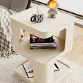 Modern White Coffee Table With Layered Design Mug Rabbit Figurine Books And Magazines