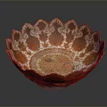 Artistic Orange And White Ceramic Bowl With Scalloped Edge And Intricate Decorative Patterns