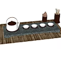 Traditional Tea Set With White Teapot Cups On Grey Stone Tray And Bamboo Mat