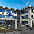 Modern Multi Story Office Building With Glass Windows Front Entrance And Metal Gate Fence