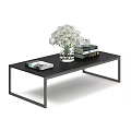 Black Modern Dining Table with Minimalist Design White Flower Bouquet Books and Small Cup