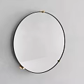 Round Wall Mounted Mirror With Black Frame And Gold Accents In Modern Interior Design