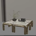Modern Coffee Table With Marble Top Gold Legs And Black Vase Green Plants On Top