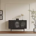 Modern Black Console Cabinet with Drawers Glass Doors Wall Art and Floor Lamp Near Potted Plant
