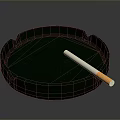 Green Round Glass Ashtray With White Cigarette On Dark Background
