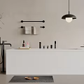 White Freestanding Bathtub in Minimalist Bathroom with Black Faucet Towel Rack and Toiletries
